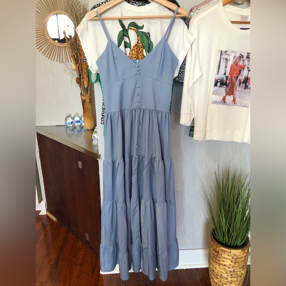 Blue long dress with button details.